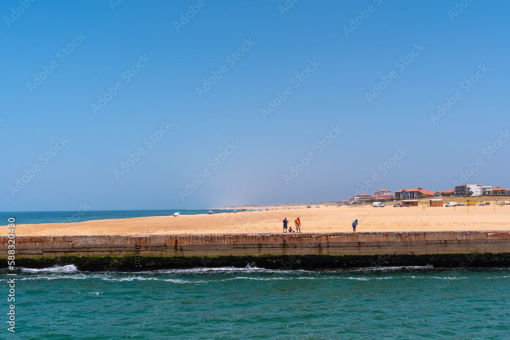 Capbreton village on the coast of the French Basque Country, people fishing in the river, France