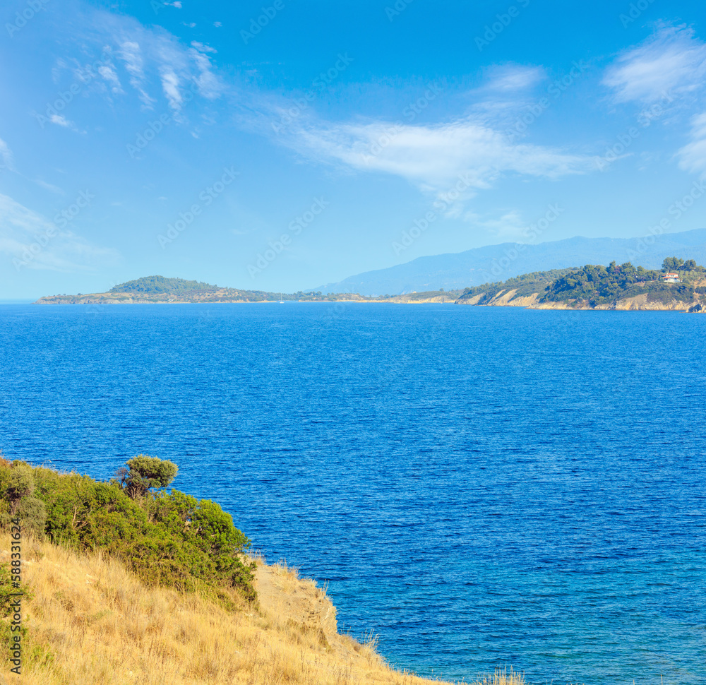 Summer Aegean Sea coast landscape (Ormos Panagias, Halkidiki, Greece).
