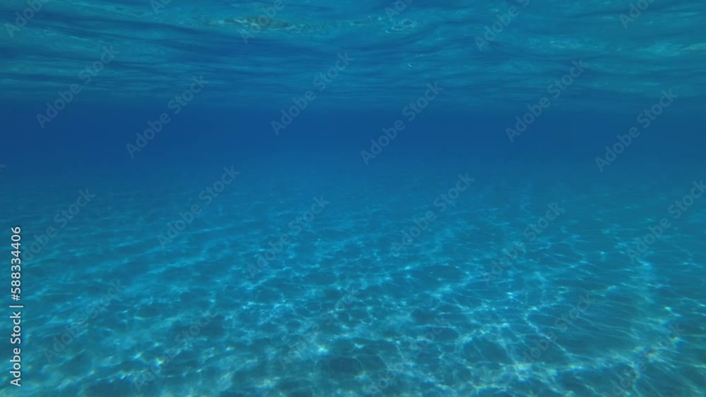 In the field of view of the camera, you can see the vibrating sea surface and the play of sun glare on the sandy bottom. In the field of view of the camera, you can see the vibrating sea surface and the play of sun glare on the sandy bottom.