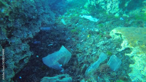 Plastic pollution: sea waves and currents collect natural debris and plastic waste in the recesses of the bottom.
