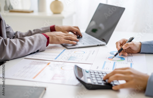 Close up hand man and woman planning budget, using calculator and laptop, reading documents, young female checking finances, counting bills or taxes, online banking services, sitting at desk