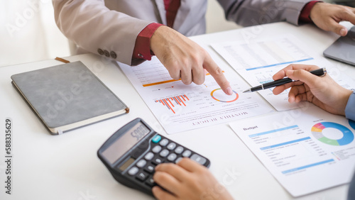 Close up hand man and woman planning budget, using calculator and laptop, reading documents, young female checking finances, counting bills or taxes, online banking services, sitting at desk