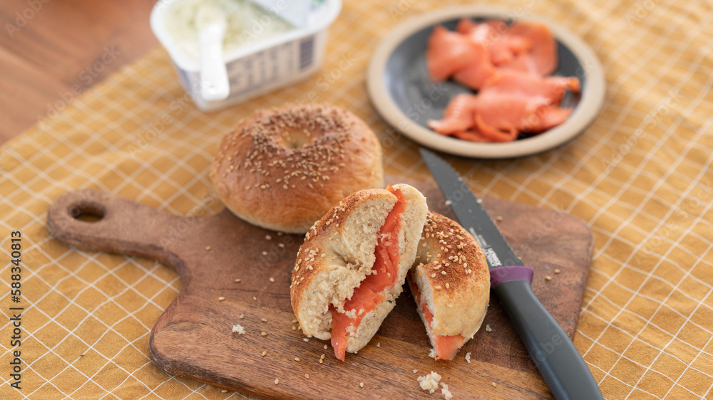 Salmon bagels on a wooden cutting board Salmon bagels on a wooden cutting board