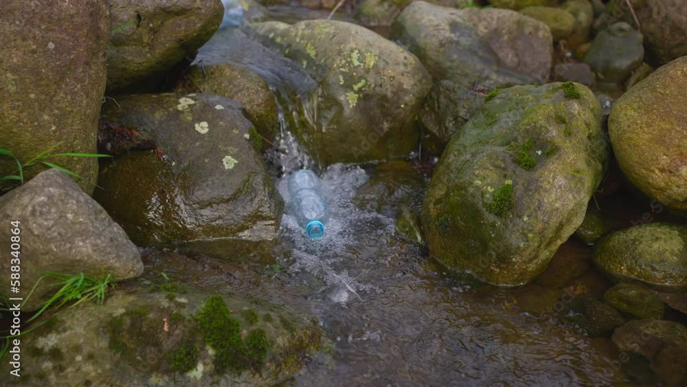 plastic garbage in a mountain river, the problem of water purification and pollution microplastic plastic garbage in a mountain river, the problem of water purification and pollution microplastic
