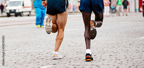 Φωτογραφία two runners kenyan and european running marathon, jogger run world championships