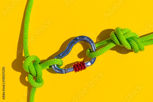 carabiner with rope. Equipment for climbing and mountaineering. Safety rope. Node eight. Minimal concept