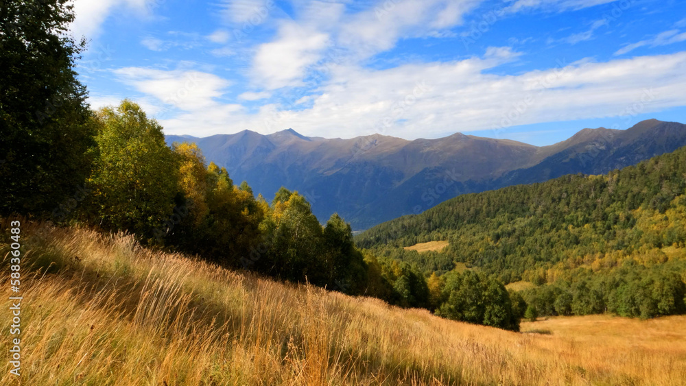 mountain landscape, shot of Arkhyz mountains at autumn with blue sky - photo of nature