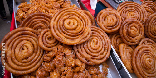 Delicious Testy sweet fried jalebi showing for sale on a street food market in the Chakbazar, Dhaka-Bangladesh