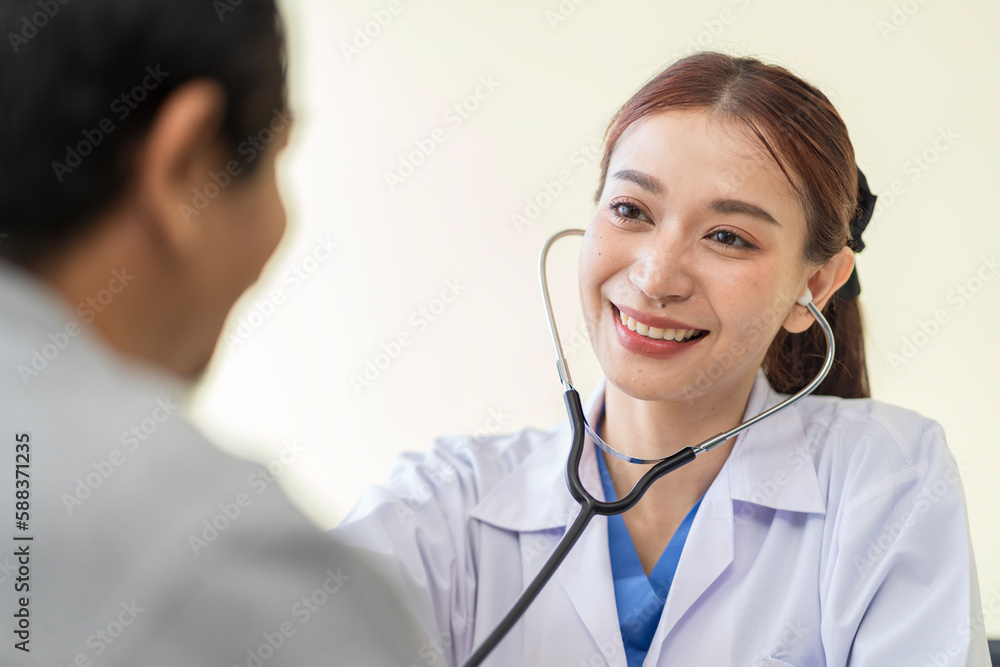 Asian doctor talking to patient with smile to encourage patients at the hospital Asian doctor talking to patient with smile to encourage patients at the hospital