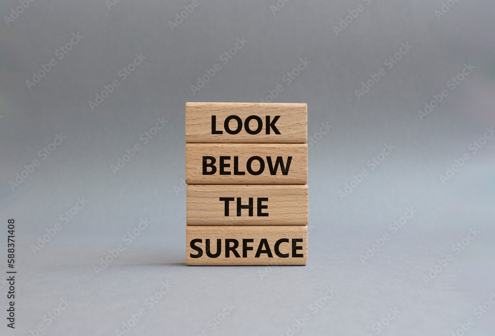 Look below the surface symbol. Concept word Look below the surface on wooden blocks. Beautiful grey background. Business and Look below the surface concept. Copy space Look below the surface symbol. Concept word Look below the surface on wooden blocks. Beautiful grey background. Business and Look below the surface concept. Copy space