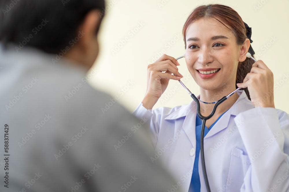Asian doctor talking to patient with smile to encourage patients at the hospital Asian doctor talking to patient with smile to encourage patients at the hospital