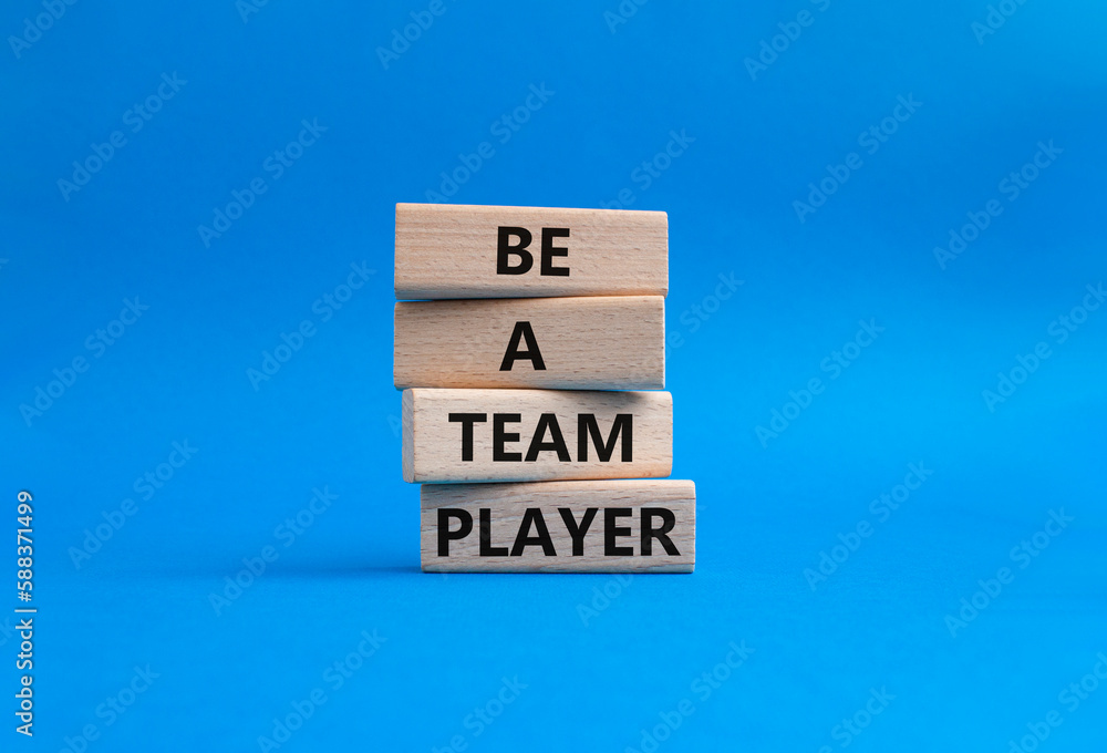 Be a team player symbol. Concept words Be a team player on wooden blocks. Beautiful blue background. Business and Be a team player concept. Copy space Be a team player symbol. Concept words Be a team player on wooden blocks. Beautiful blue background. Business and Be a team player concept. Copy space