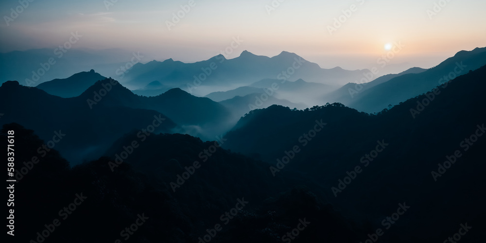 Mountain peak surrounded by fog at dawn