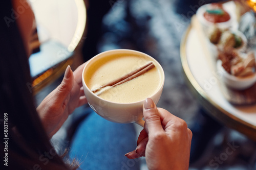 Canvas Print a close up of a person holding a cup of coffee