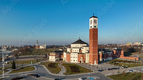 Lagiewniki, Krakow, Poland. Sanctuary, church and info center commemorating activity of Pope John Paul II. Aerial view. Divine Mercy Church and St Faustina sanctuary in the background. Aerial video photo