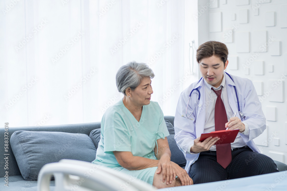 Asian doctor talking to patient with smile to encourage patients at the hospital Asian doctor talking to patient with smile to encourage patients at the hospital