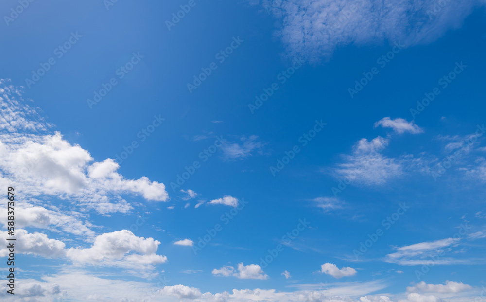 Fototapeta premium Panoramic view of clear blue sky and clouds, Blue sky background with tiny clouds. White fluffy clouds in the blue sky. 