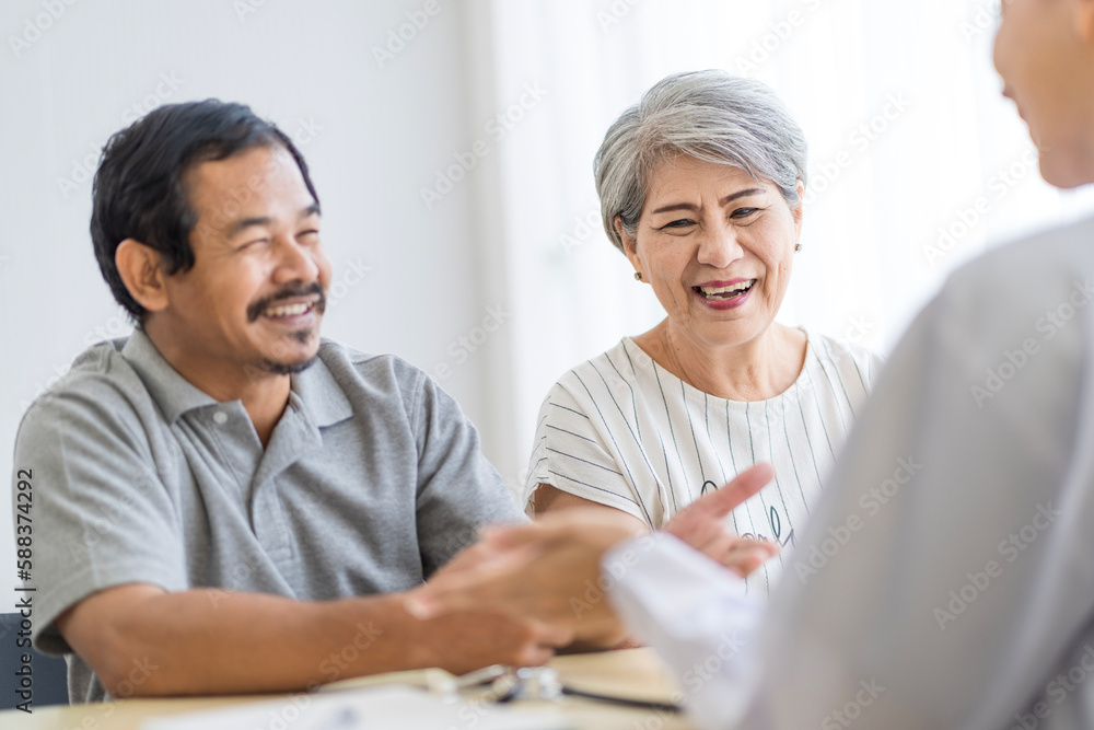 Asian seniors who are healthy, in a good mood, smiling, talking with financial or life insurance staff to take care of life after retirement. Asian seniors who are healthy, in a good mood, smiling, talking with financial or life insurance staff to take care of life after retirement.