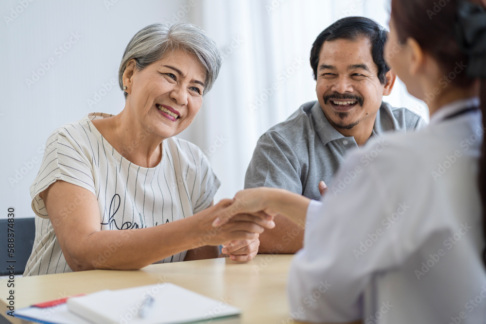 Asian seniors who are healthy, in a good mood, smiling, talking with financial or life insurance staff to take care of life after retirement. Asian seniors who are healthy, in a good mood, smiling, talking with financial or life insurance staff to take care of life after retirement.