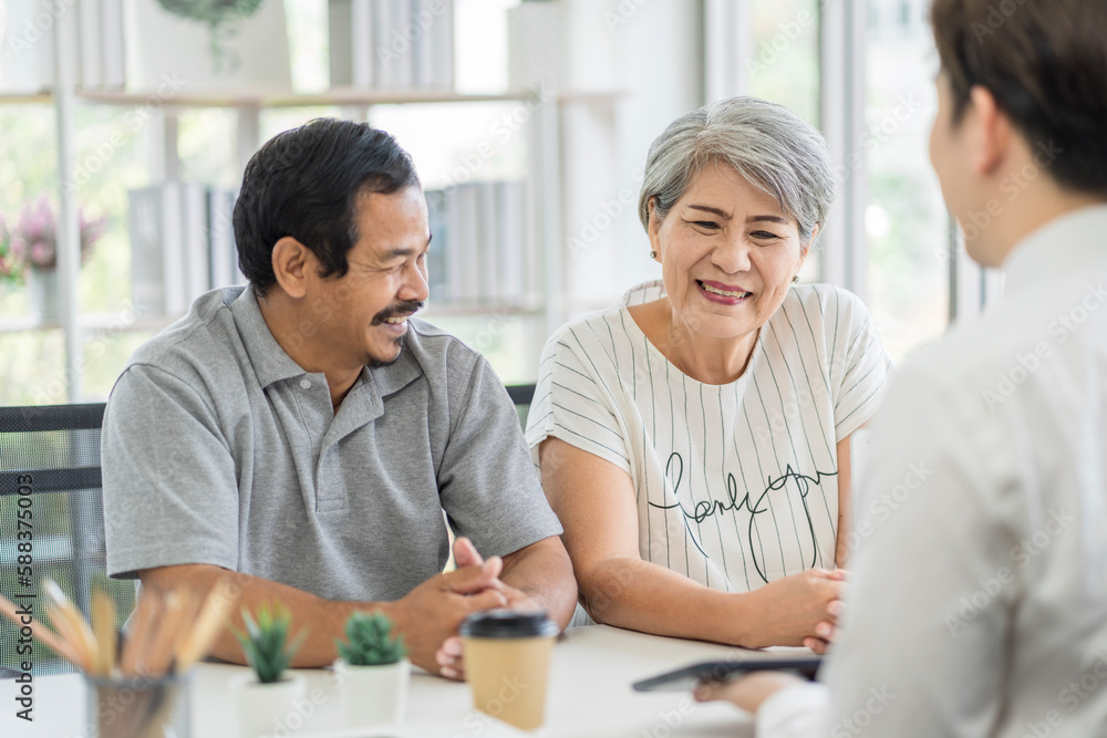 Asian seniors who are healthy, in a good mood, smiling, talking with financial or life insurance staff to take care of life after retirement.