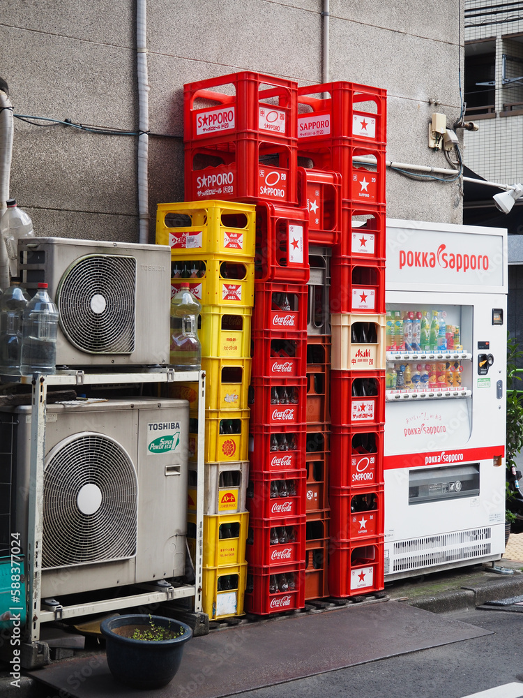 TOKYO, JAPAN April 2, 2023 Crates of empty glass bottles, including