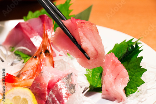 fresh fish platter sashimi on a plate, close up, select focus