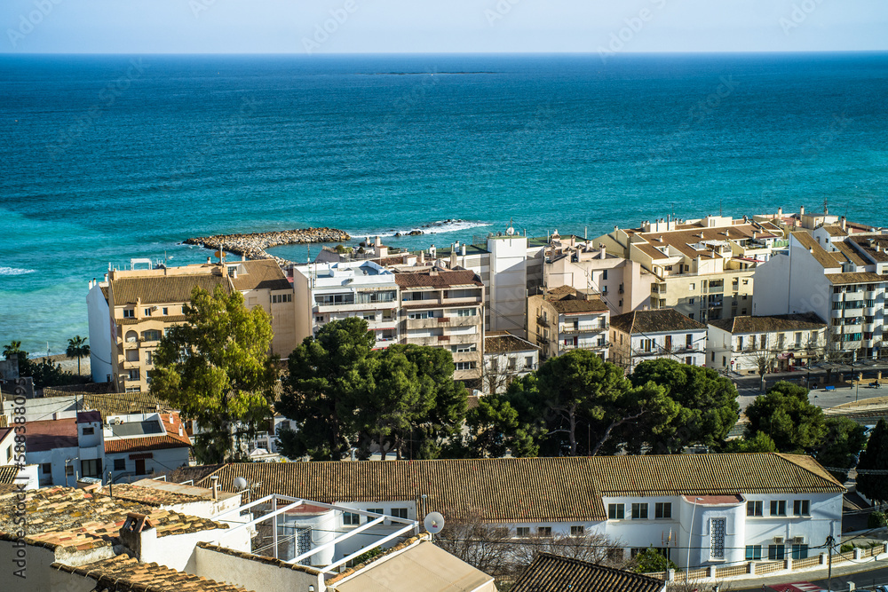 The classic Spanish white town of Altea. View from the old town to the Mediterranean Sea, the modern part of the city and the Benidorm apartment buildings