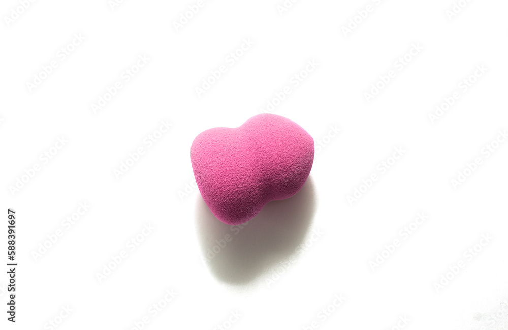 Pink makeup sponge on a white background. Means for applying professional make-up