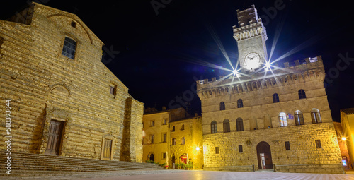 Фотография The clock tower of the old town of Montepulciano at night, Italy