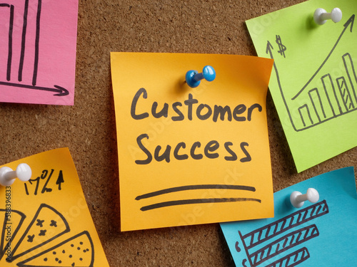 Sticker with inscription customer success pinned to the board.