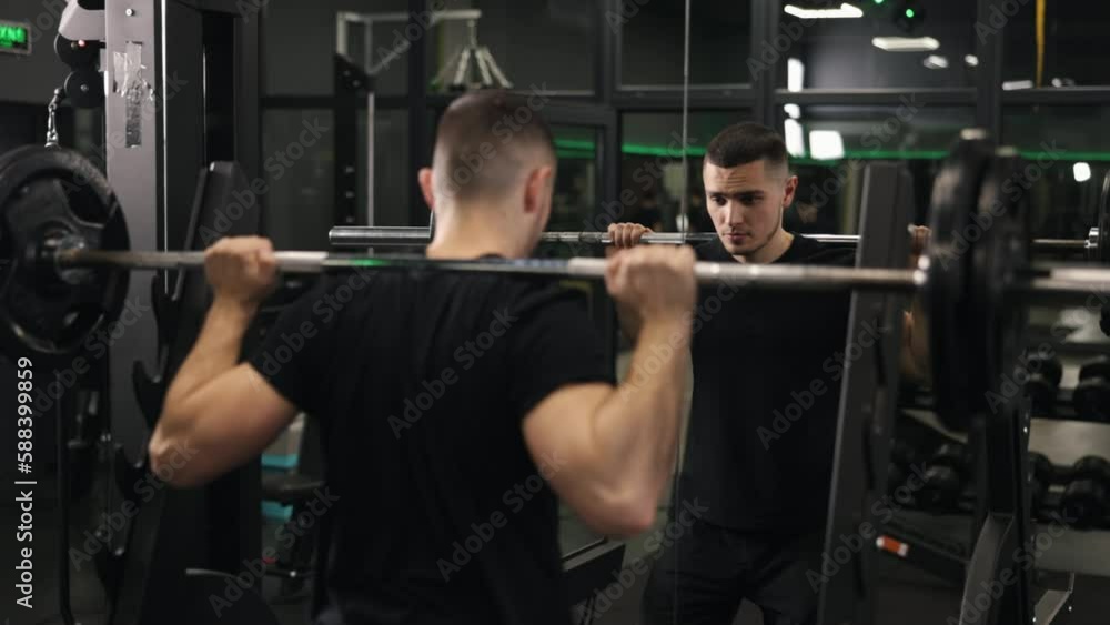 Barbell squats, Squat safety, Fitness motivation. Bodybuilder executes