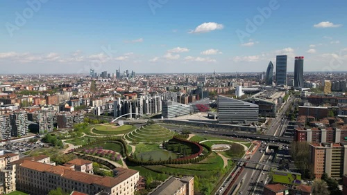 Italy , Milan 2023 - drone aerial view from Montagnetta di San Siro of downtown  with Citylife district , Garibaldi  square and Portello new modern area of the city - tourist attraction sightseeing