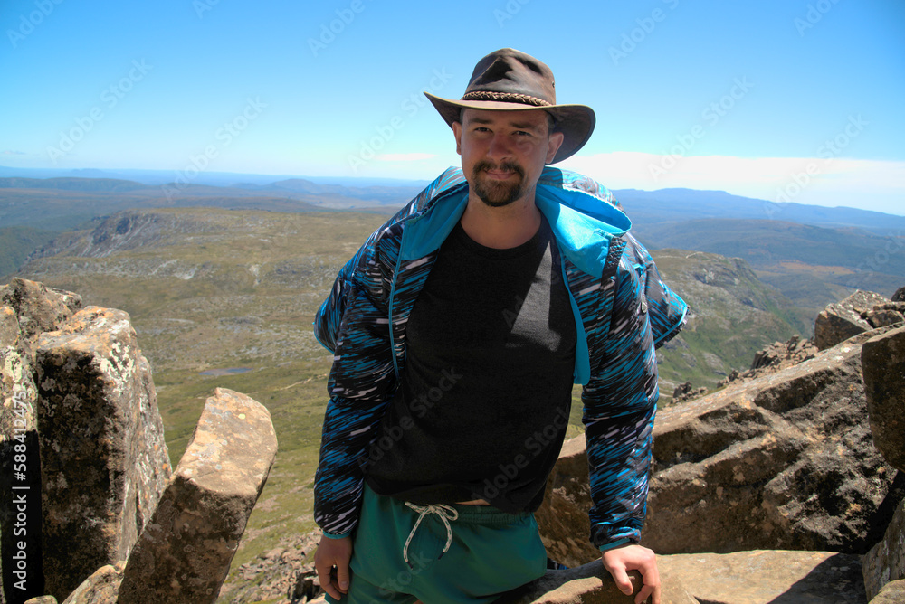 Fototapeta premium The traveler went up the mountain. This is the beauty of the mountains. This is mountain climbing. Australia. Tasmania. This is an encounter with wildlife. 