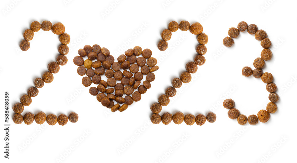 Calendar 2023 from Dry pet food and heart shape from crispy granules on a white background. Calendar 2023 from Dry pet food and heart shape from crispy granules on a white background.