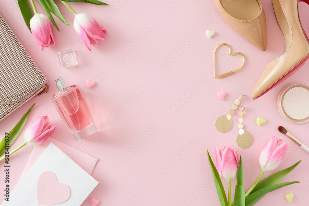 Obraz premium Top view photo of trendy woman shoes perfume bottle cosmetics handbag postcard and pink tulips on pastel pink background with empty space in the middle. Mother's Day concept