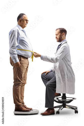 Doctor measuring waist of a mature male patient