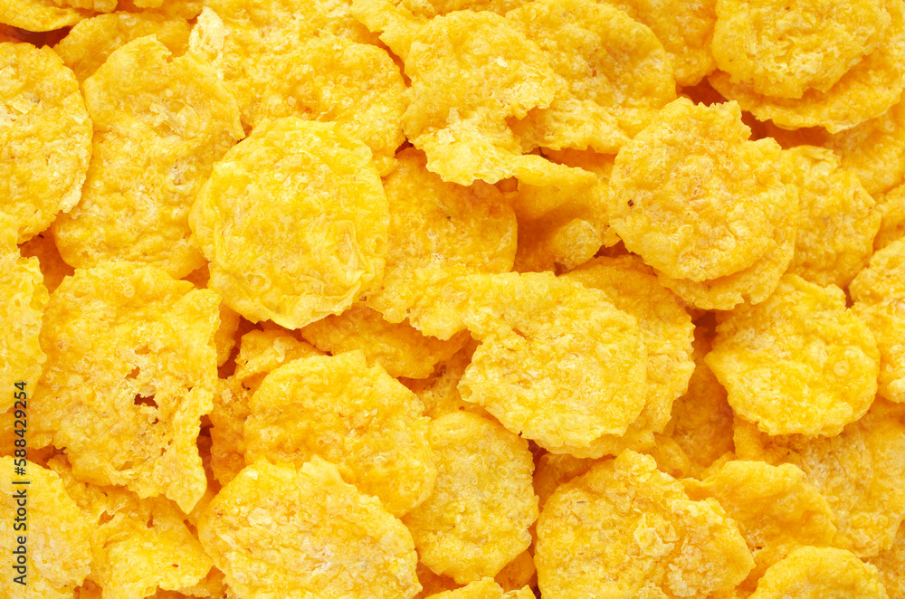 Yellow corn flakes background, texture, top view. Corn flakes for morning breakfast, background, texture, top view. Background and texture of yellow corn flakes, top view. Yellow corn flakes background, texture, top view. Corn flakes for morning breakfast, background, texture, top view. Background and texture of yellow corn flakes, top view.