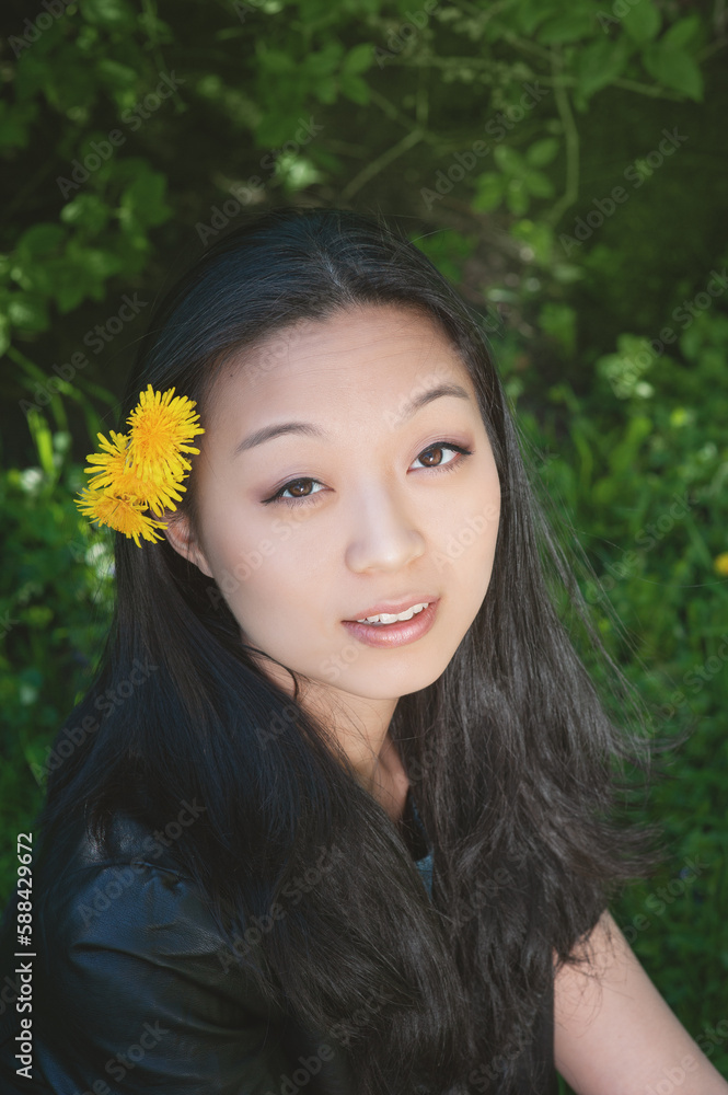Beautiful young happy smiling asian woman with dandelion flowers Beautiful young happy smiling asian woman with dandelion flowers