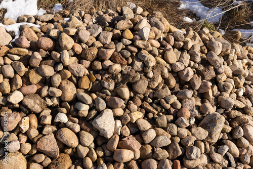 a pile of stones collected after clearing the field for sowing