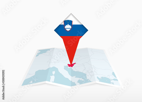 Slovenia is depicted on a folded paper map and pinned location marker with flag of Slovenia.