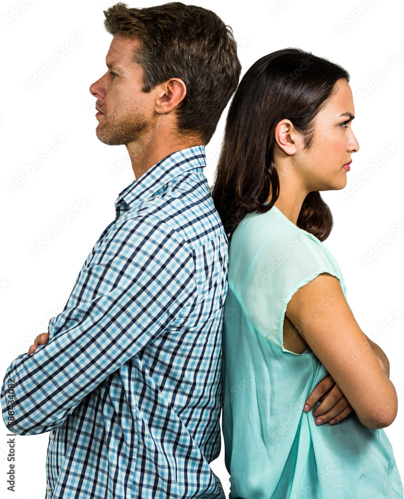 Side view of displeased couple with arms crossed standing back to back Side view of displeased couple with arms crossed standing back to back