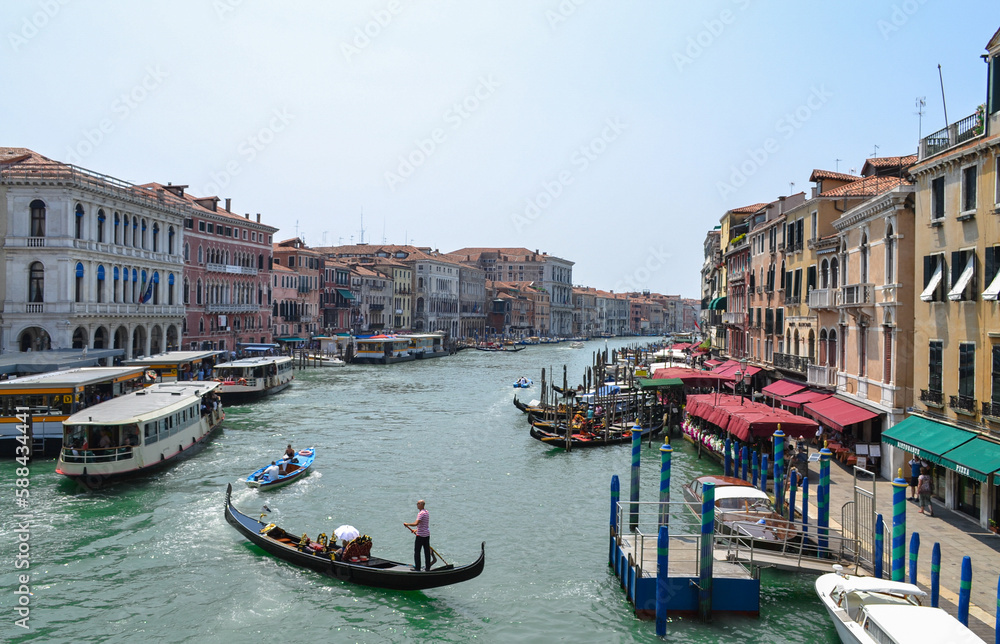 Gondoliers sail into the Grand canal in Venice.
