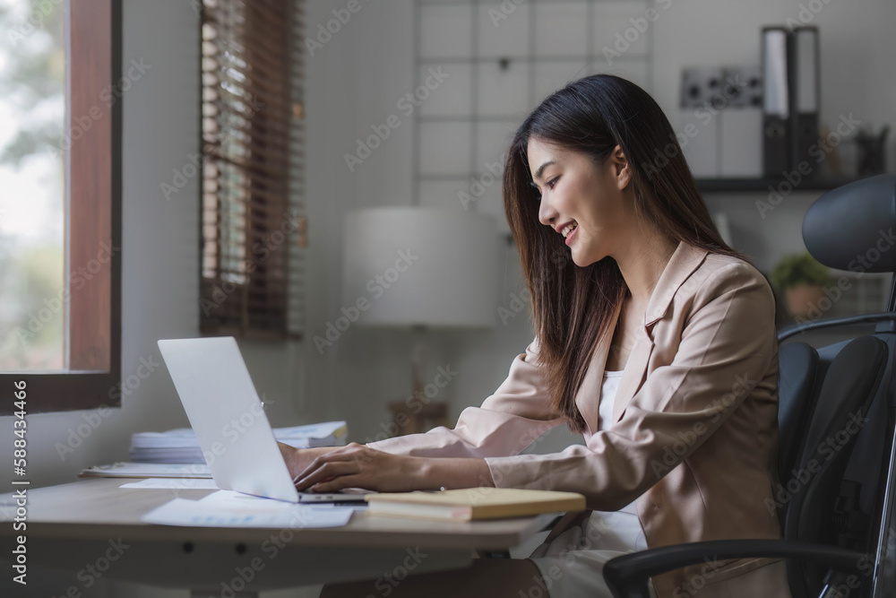 Business woman using calculator for do math finance on wooden desk in office and business working background, tax, accounting, statistics and analytic research concept. Business woman using calculator for do math finance on wooden desk in office and business working background, tax, accounting, statistics and analytic research concept.