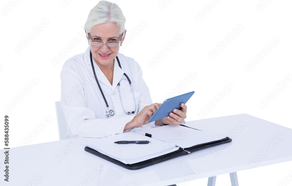 Portrait of smiling female doctor using digital tablet at desk Portrait of smiling female doctor using digital tablet at desk