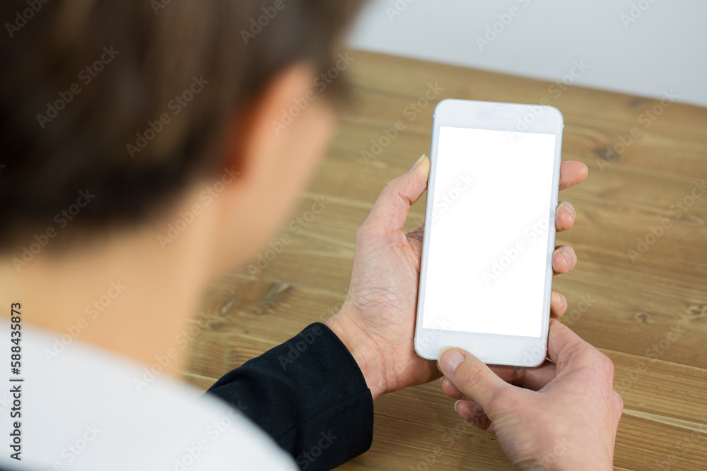 Businesswoman using phone at desk Businesswoman using phone at desk