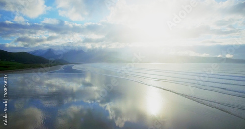 Sea against cloudy sky during sunny day © vectorfusionart