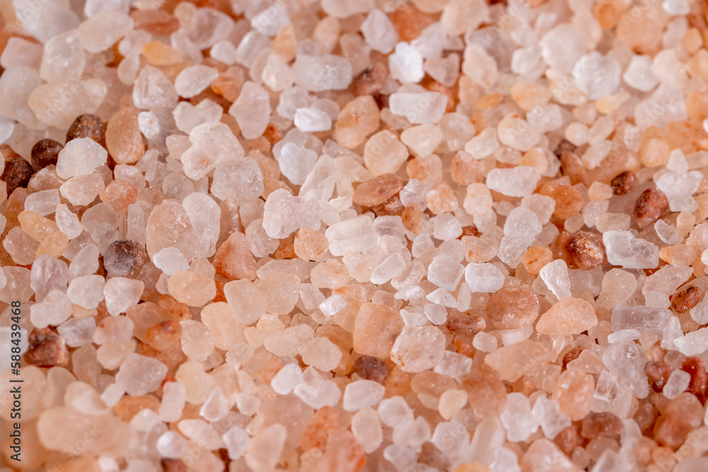 A large number of pink salt crystals of different sizes A large number of pink salt crystals of different sizes