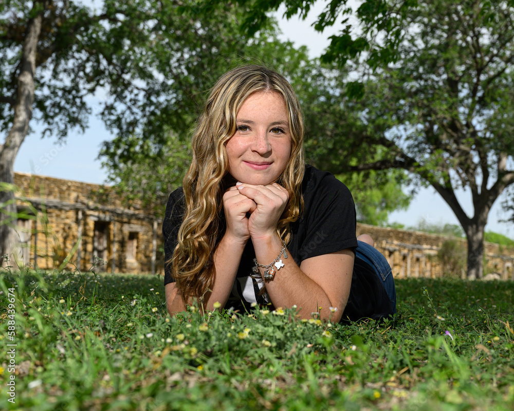 Young pretty teenage girl posing in a historic setting for her high school graduation photos Young pretty teenage girl posing in a historic setting for her high school graduation photos