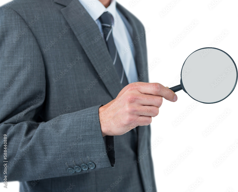 Mid section of businessman holding magnifying glass Mid section of businessman holding magnifying glass