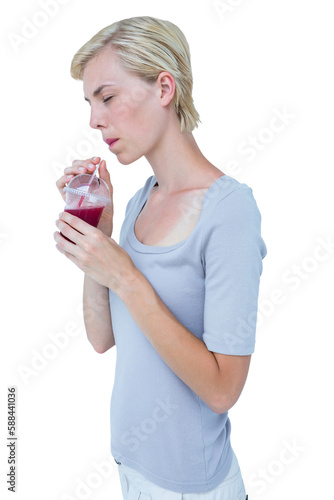 Attractive woman drinking healthy juice 
